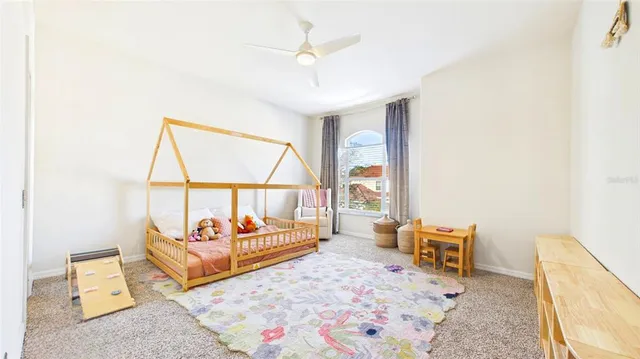 a group of people standing around a fruit stand