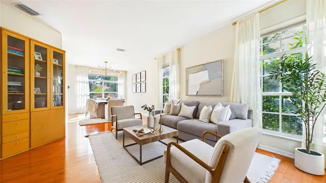 a living room with furniture and a large window