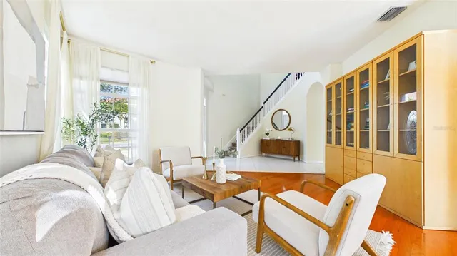a view of a dining room with furniture window and wooden floor