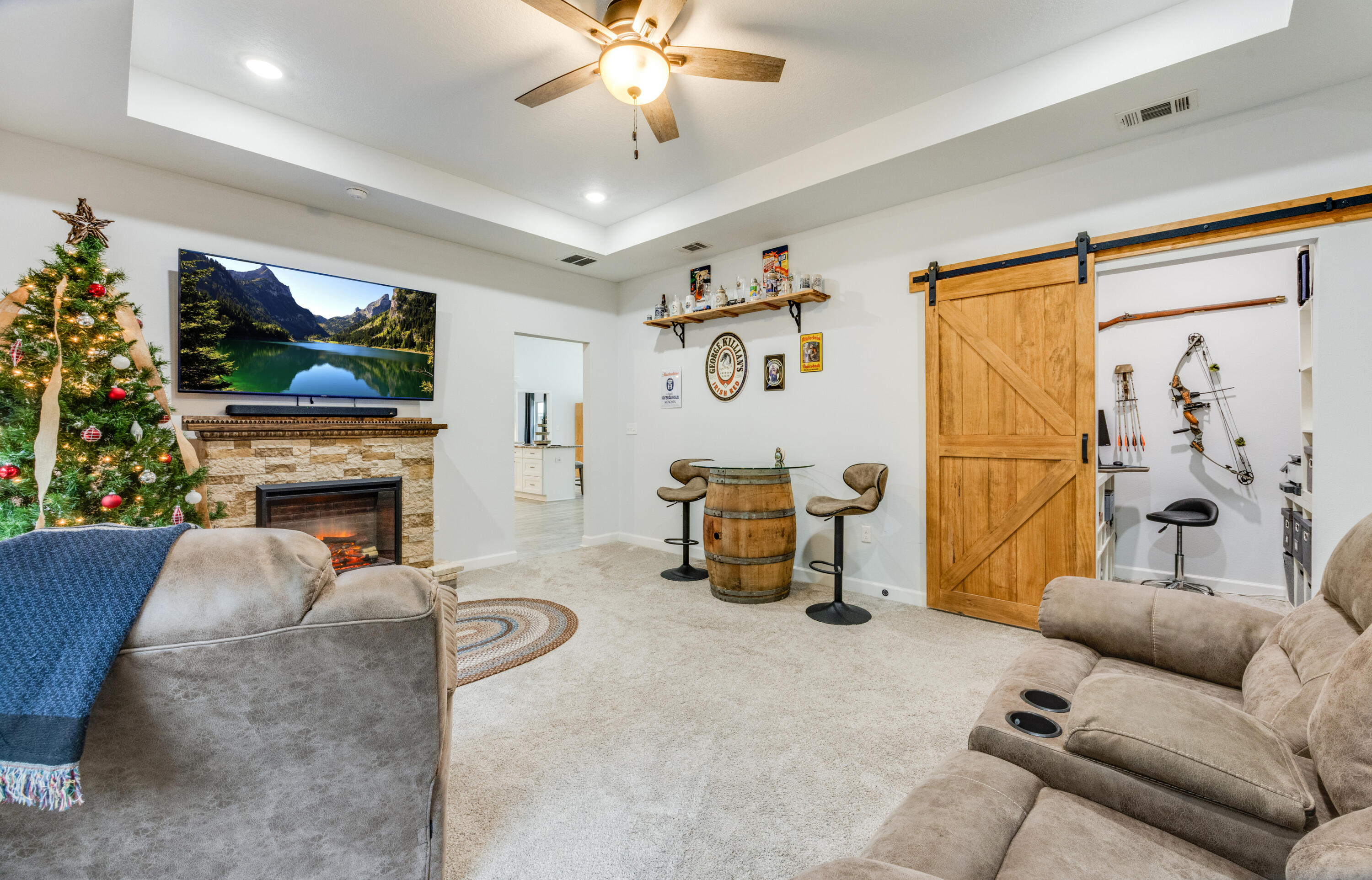 4444 Wilkerson Bluff Road Holt, FL 32564 - Photo 16 of 32 a living room with furniture a fireplace and a flat screen tv