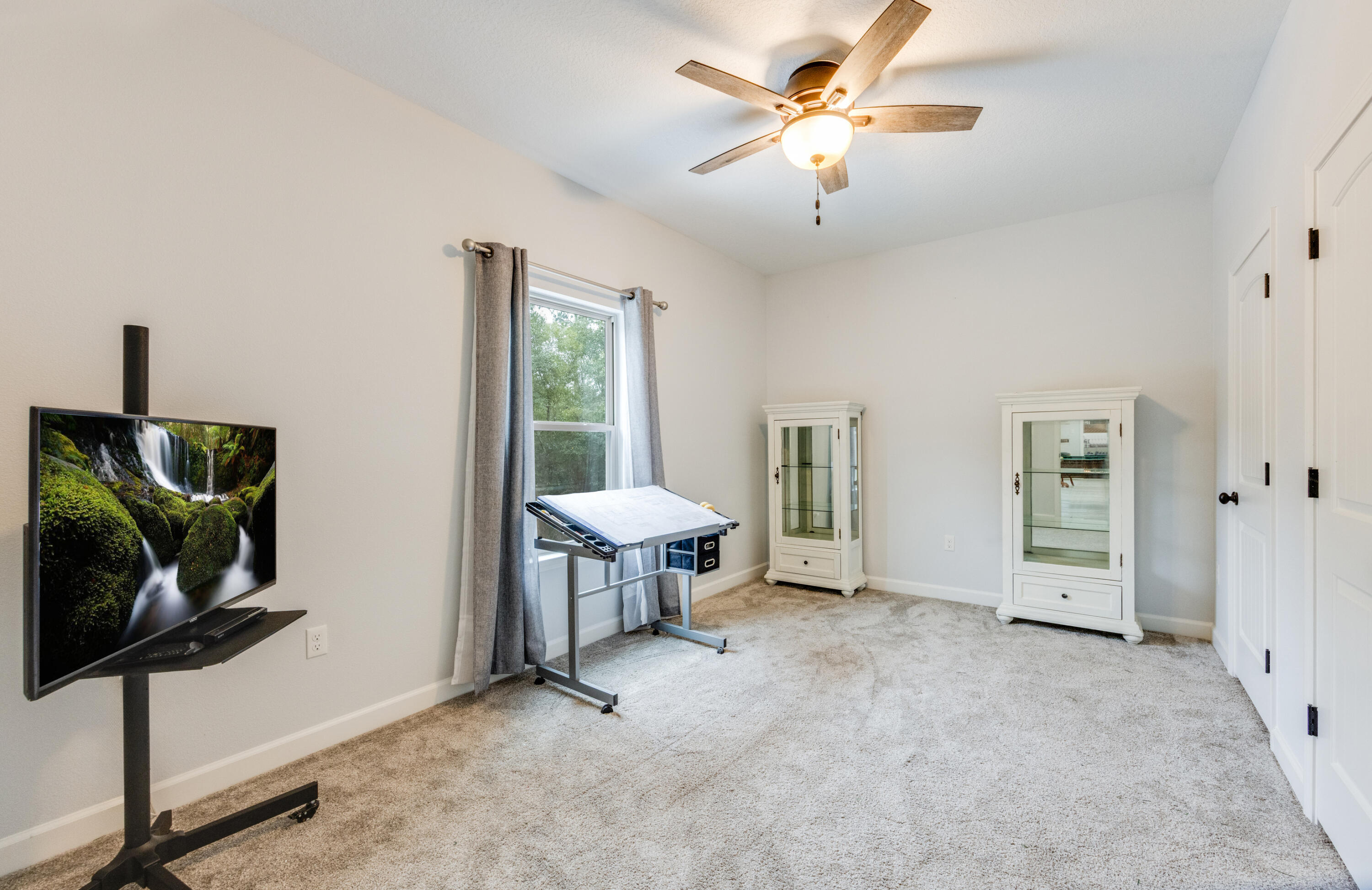 4444 Wilkerson Bluff Road Holt, FL 32564 - Photo 18 of 32 a view of a livingroom with furniture and a ceiling fan