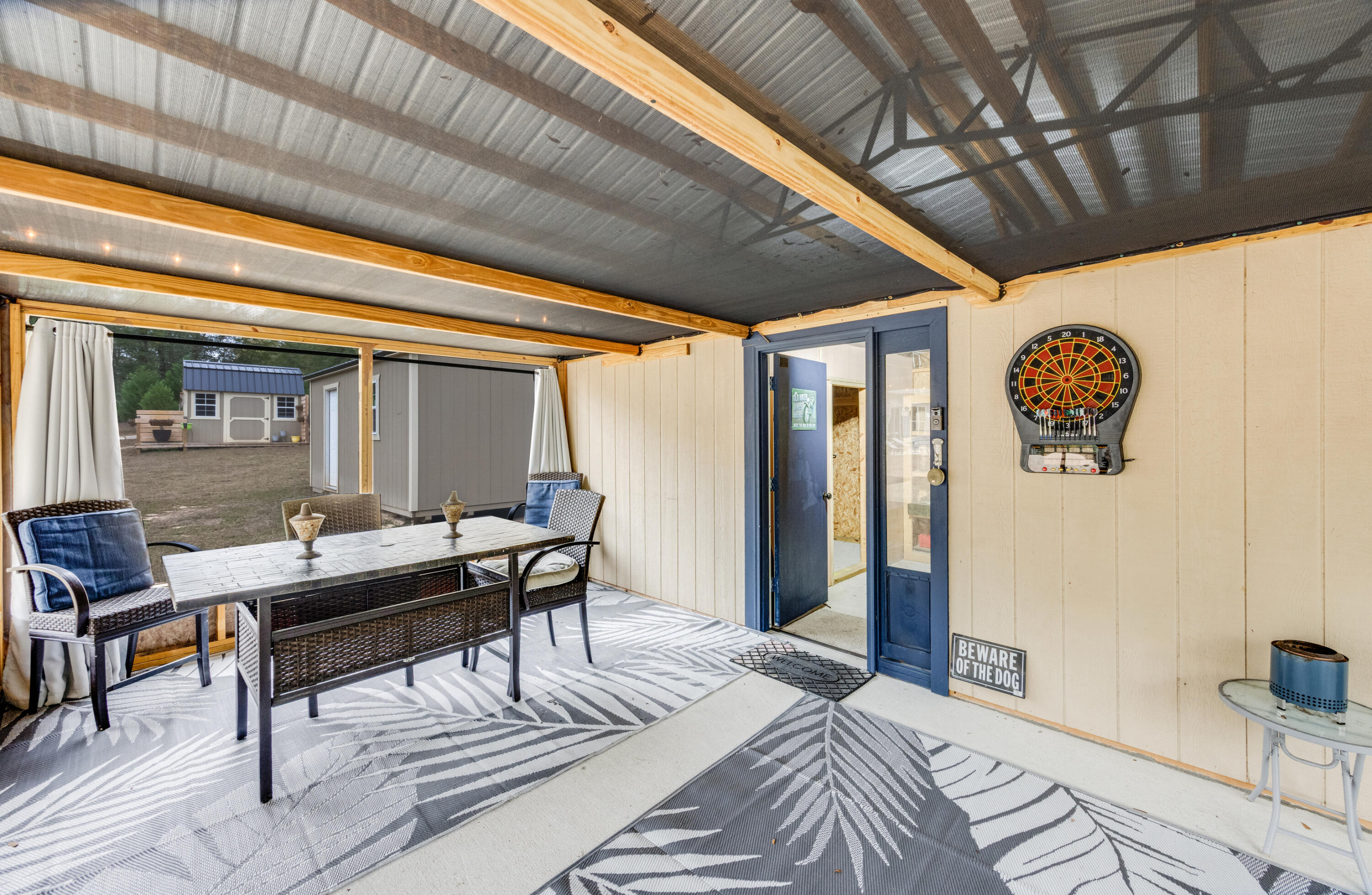 4444 Wilkerson Bluff Road Holt, FL 32564 - Photo 24 of 32 a bedroom with a bed and a table