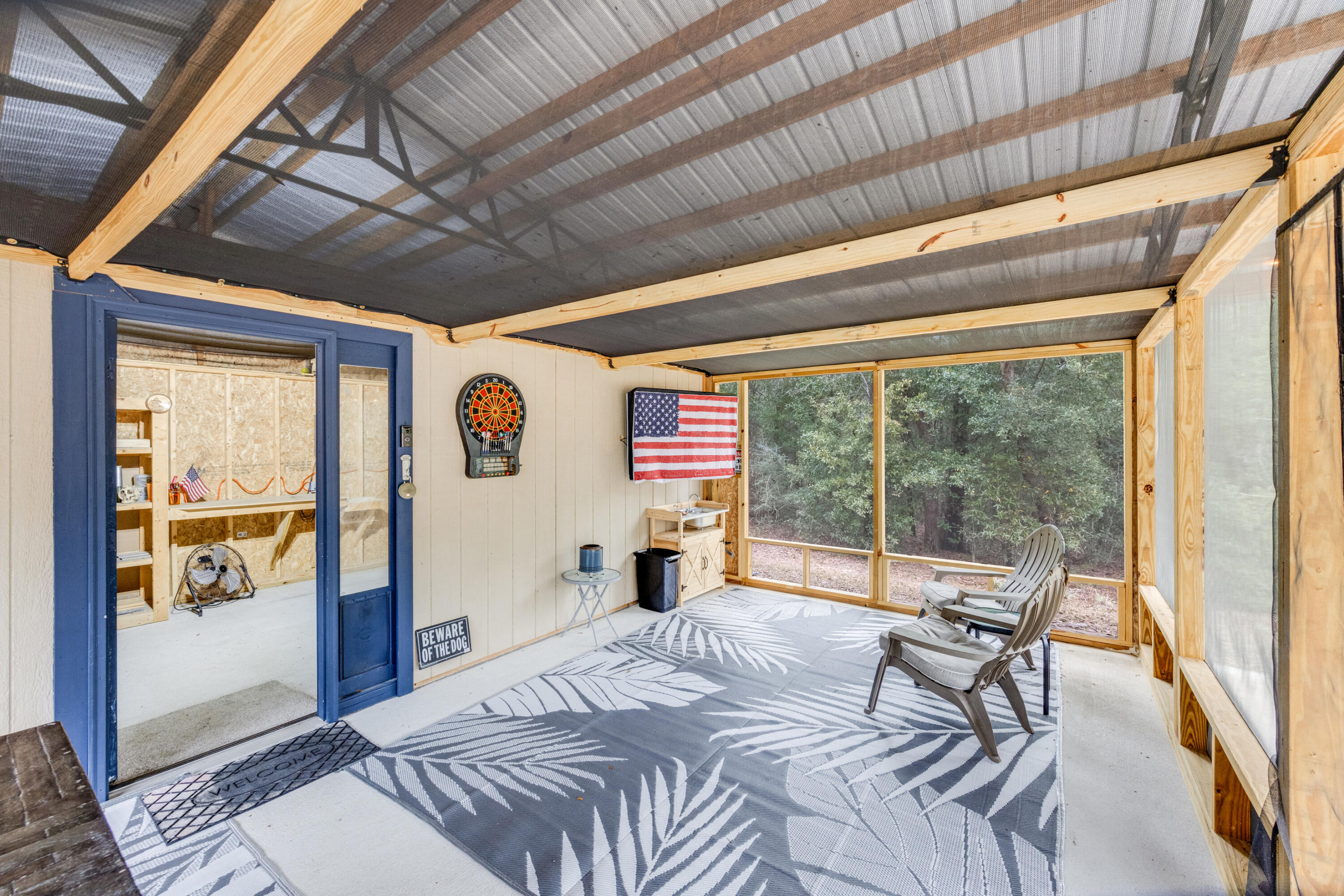 4444 Wilkerson Bluff Road Holt, FL 32564 - Photo 25 of 32 a bedroom with furniture and large windows