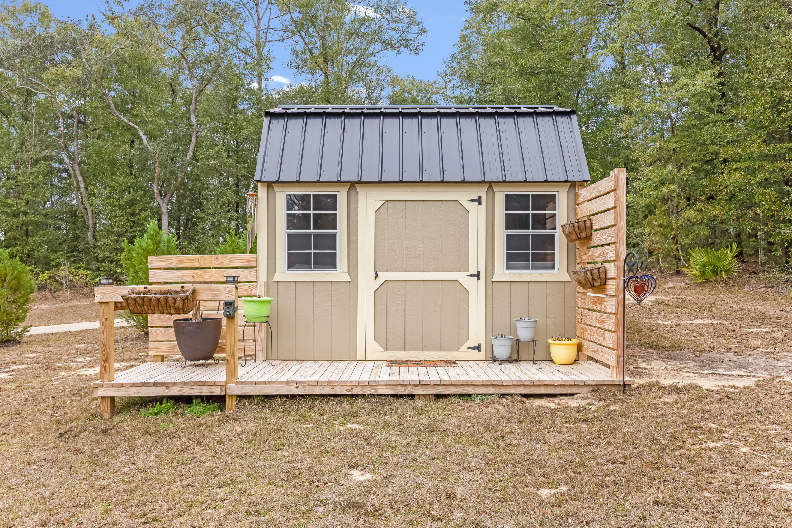 4444 Wilkerson Bluff Road Holt, FL 32564 - Photo 30 of 32 a backyard of a house with table and chairs