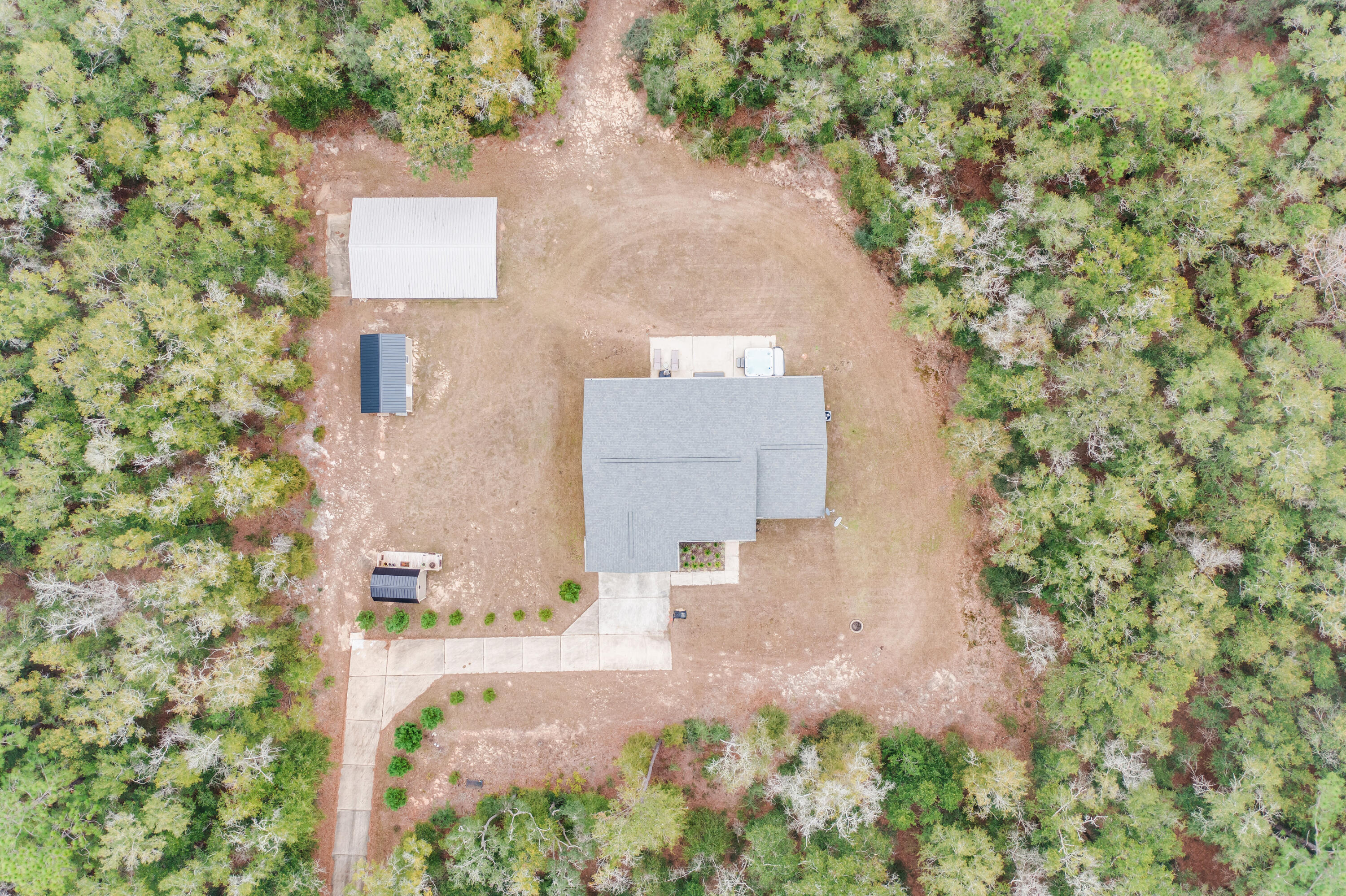 4444 Wilkerson Bluff Road Holt, FL 32564 - Photo 31 of 32 an aerial view of residential house with outdoor space