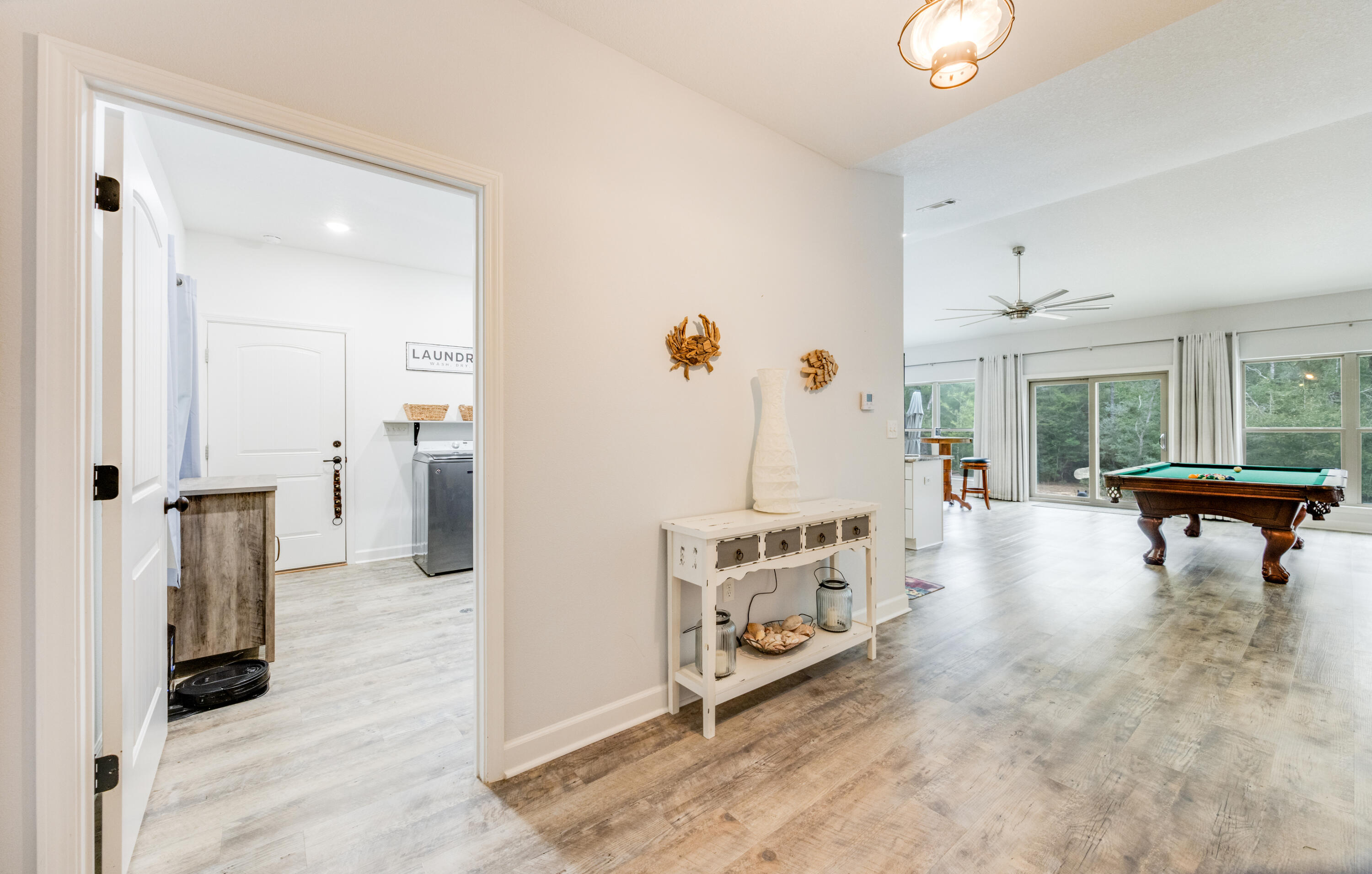 4444 Wilkerson Bluff Road Holt, FL 32564 - Photo 4 of 32 a view of a livingroom with kitchen and furniture