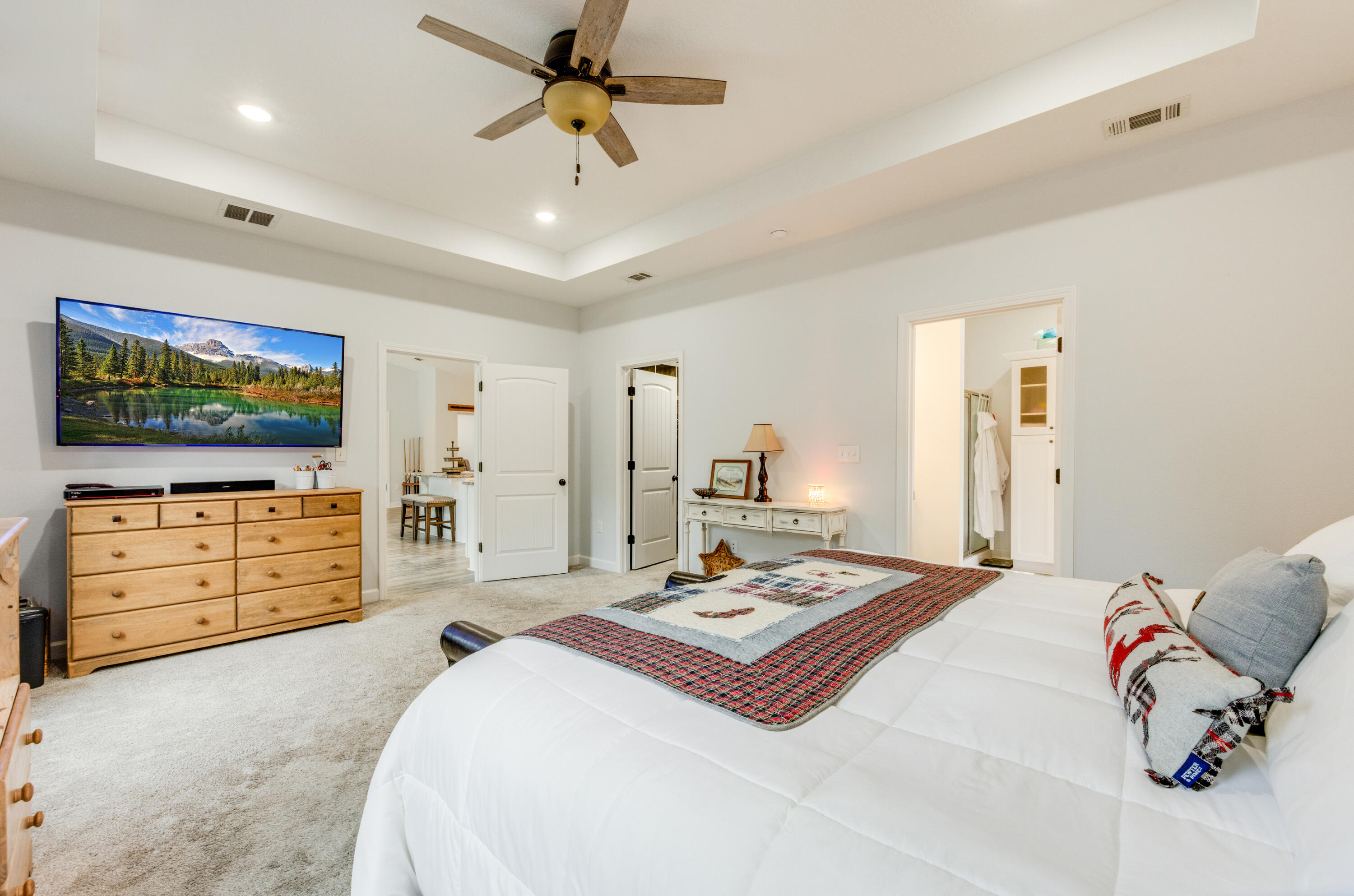 4444 Wilkerson Bluff Road Holt, FL 32564 - Photo 10 of 32 a bedroom with a bed and a flat screen tv