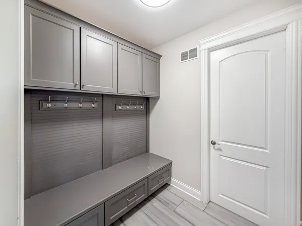 a view of storage and utility room with closet