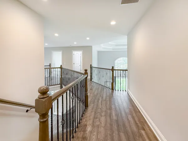 a view of entryway with wooden floor
