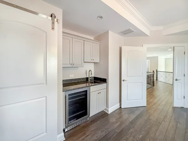 a kitchen with a stove and a refrigerator