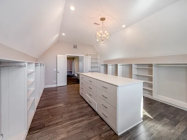 a room with cabinets and wooden floor