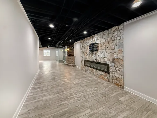 a view of an empty room with a fireplace