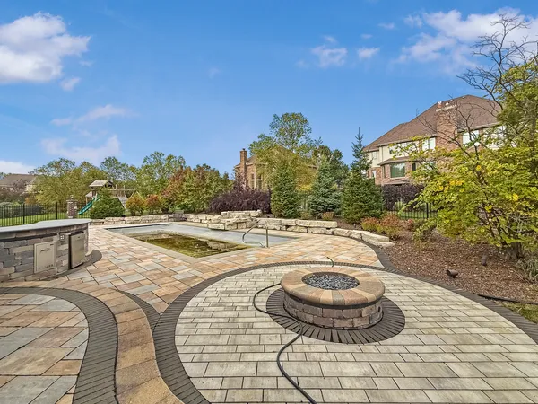 a view of swimming pool with a chairs