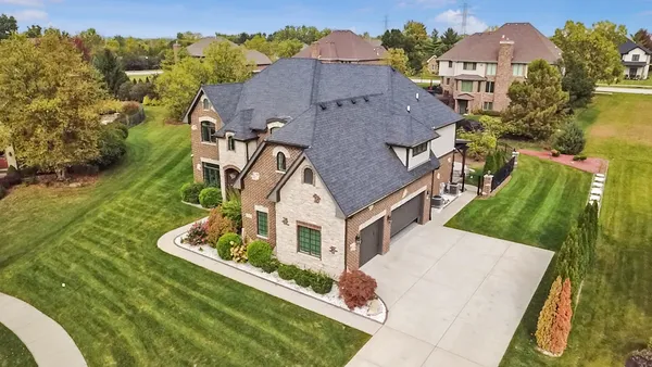 an aerial view of a house with a garden
