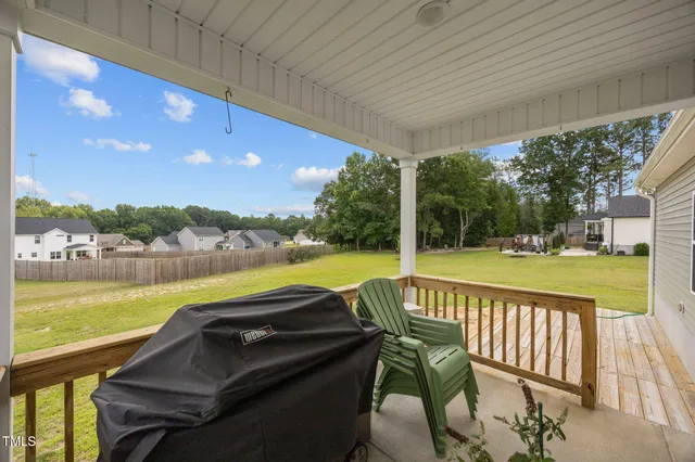 a view of swimming pool with outdoor seating and plants