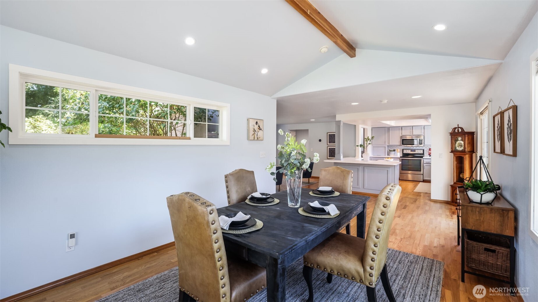 13735 Southeast 172nd Street Renton, WA 98058 - Photo 11 of 29 a view of a dining room with furniture window and wooden floor
