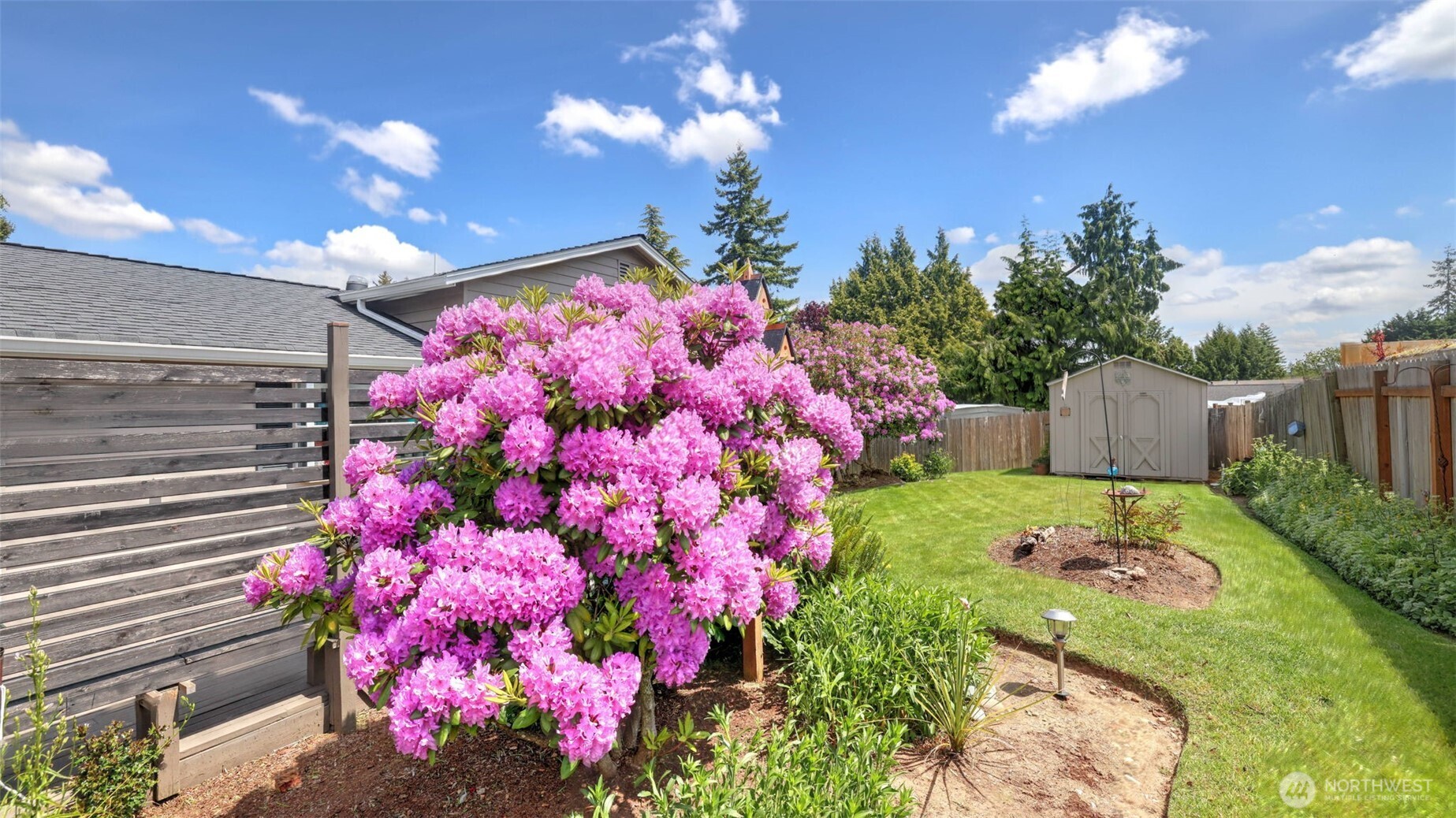 13735 Southeast 172nd Street Renton, WA 98058 - Photo 24 of 29 a front view of a house with a yard and fountain