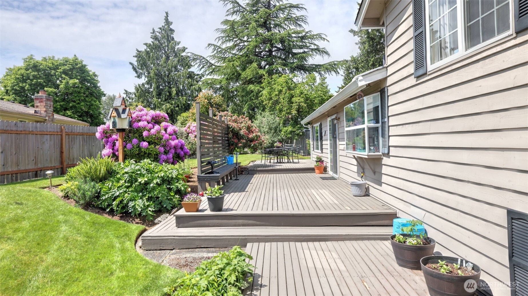 13735 Southeast 172nd Street Renton, WA 98058 - Photo 27 of 29 a view of flower garden with wooden bench