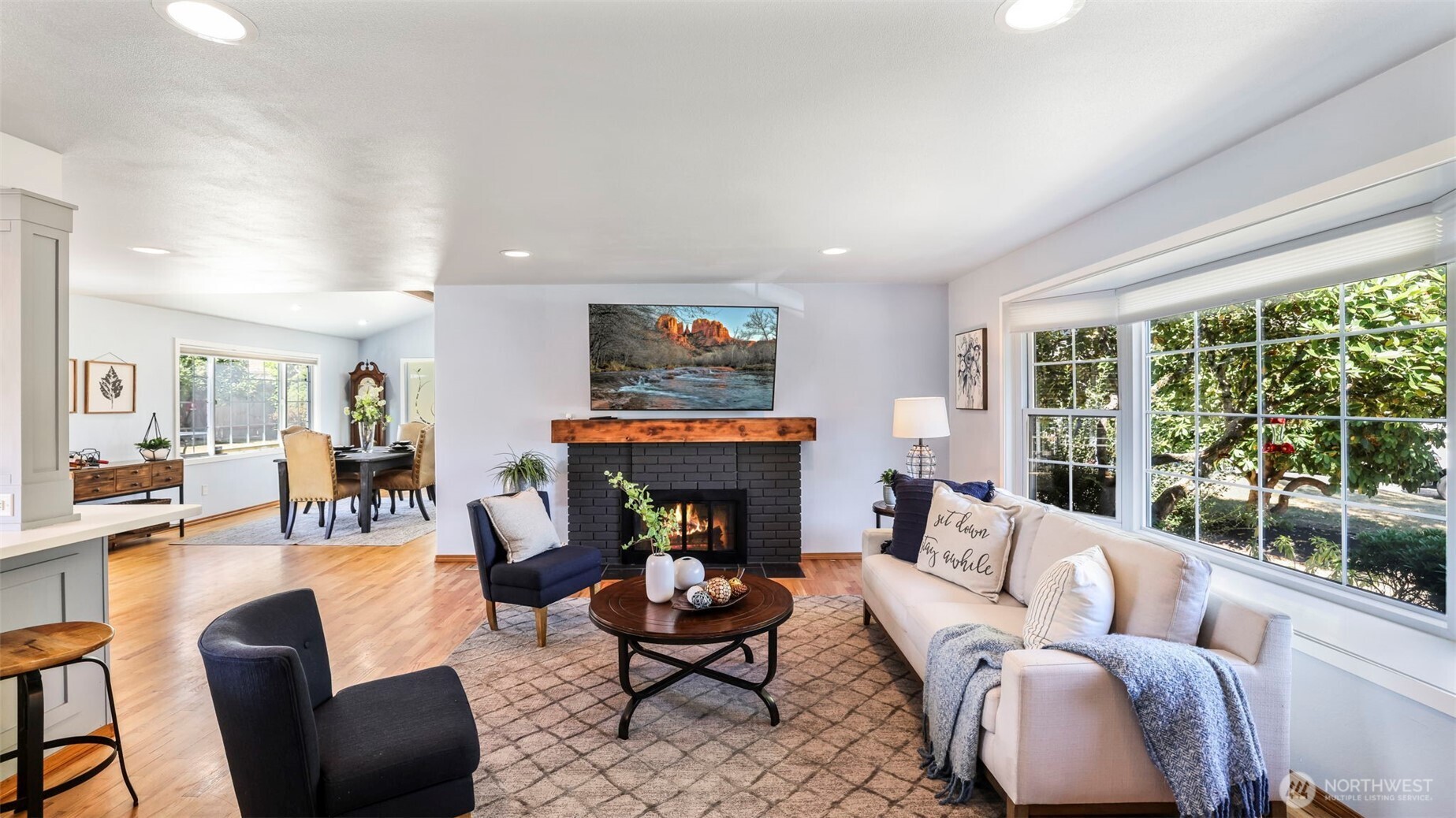 13735 Southeast 172nd Street Renton, WA 98058 - Photo 3 of 29 a living room with furniture fireplace and a large window