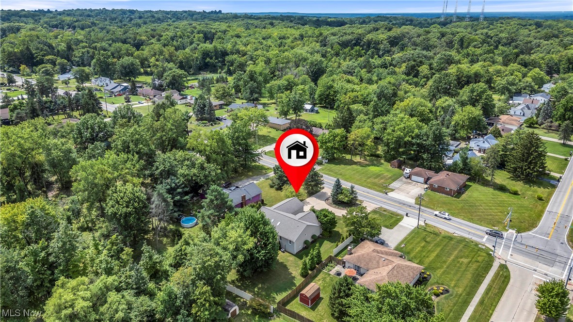 8651 State Road North Royalton, OH 44133 - Photo 33 of 33 Aerial overview of property's location with nearby suburban area and a forest