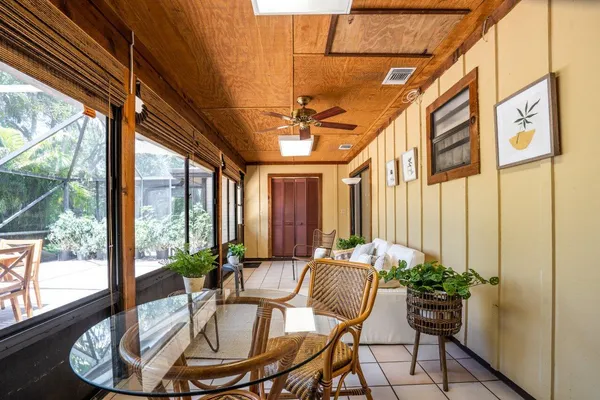 a view of a dining room with furniture window and outside view