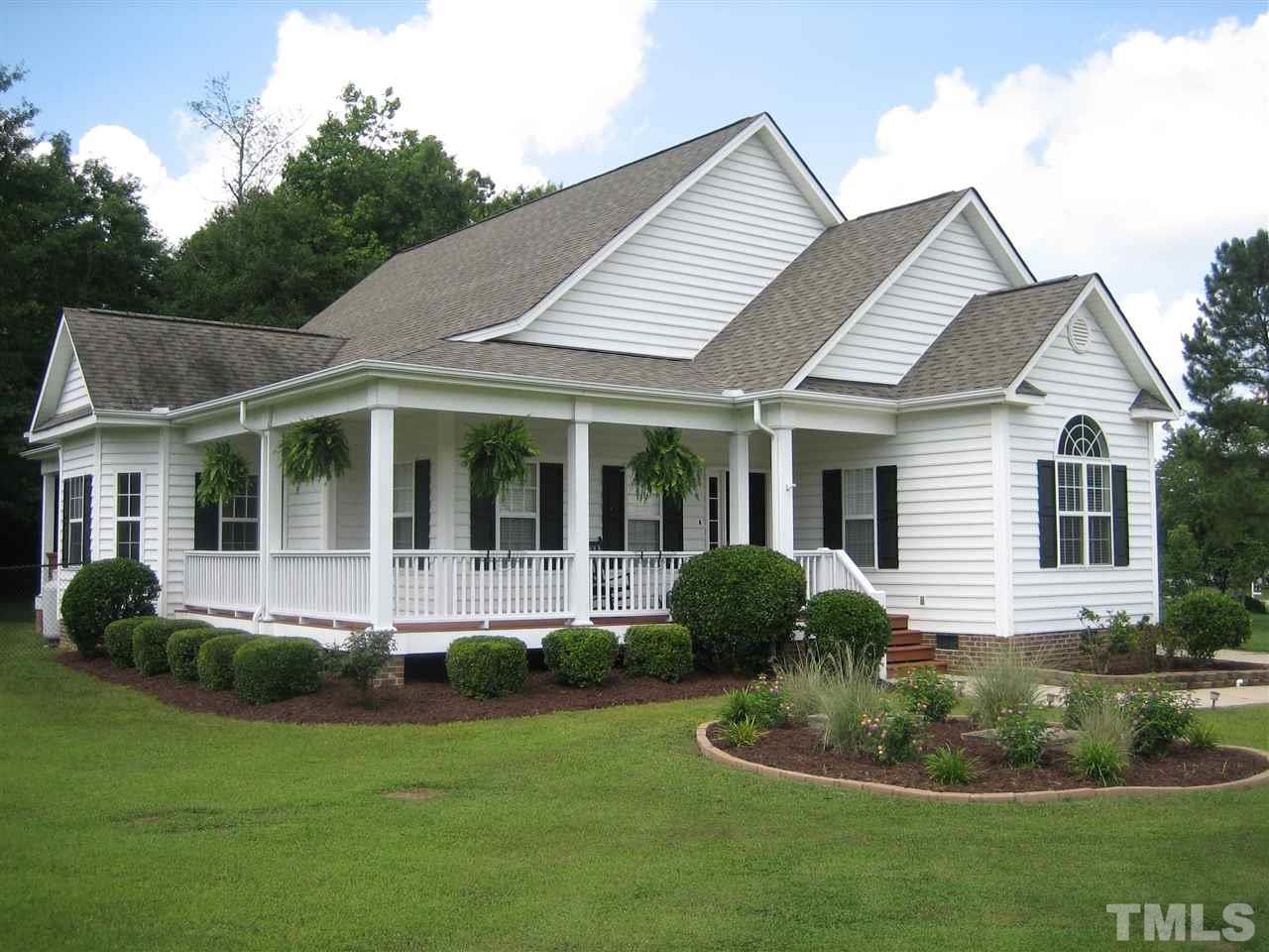 1232 Jogging Court Raleigh, NC 27603 - Photo 1 of 25 a front view of a house with a yard