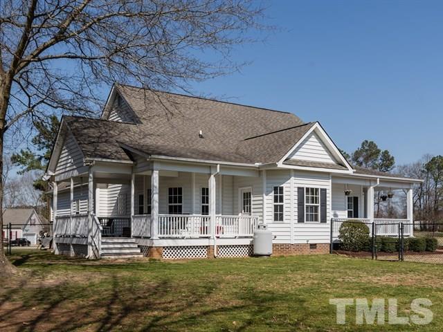 1232 Jogging Court Raleigh, NC 27603 - Photo 22 of 25 a front view of a house with a garden