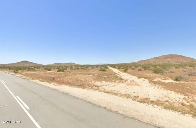 a view of an ocean and mountain