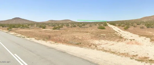 a view of an ocean and a mountain