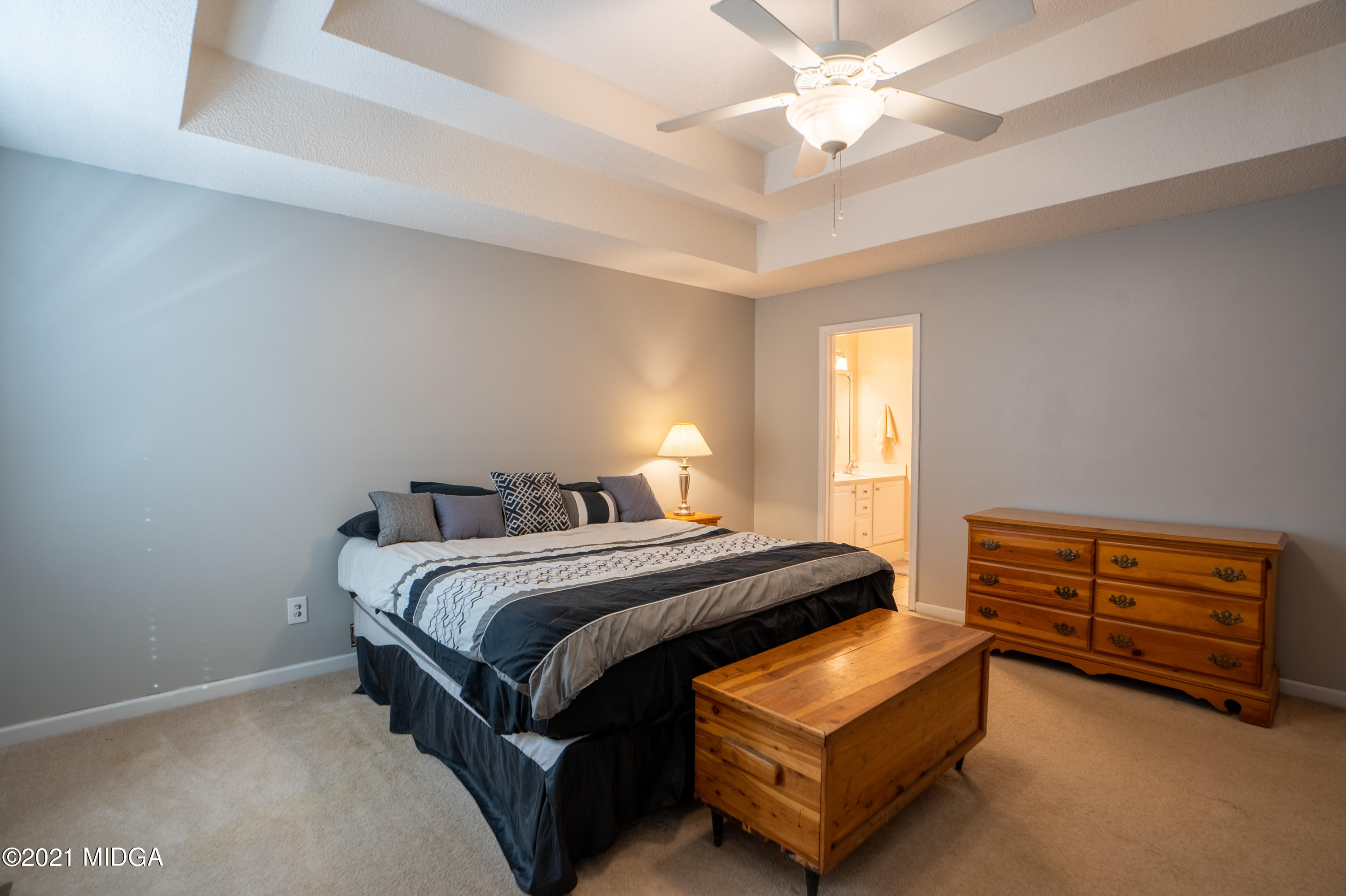 208 Camelot Road Gray, GA 31032 - Photo 16 of 41 a bedroom with a bed and a dresser
