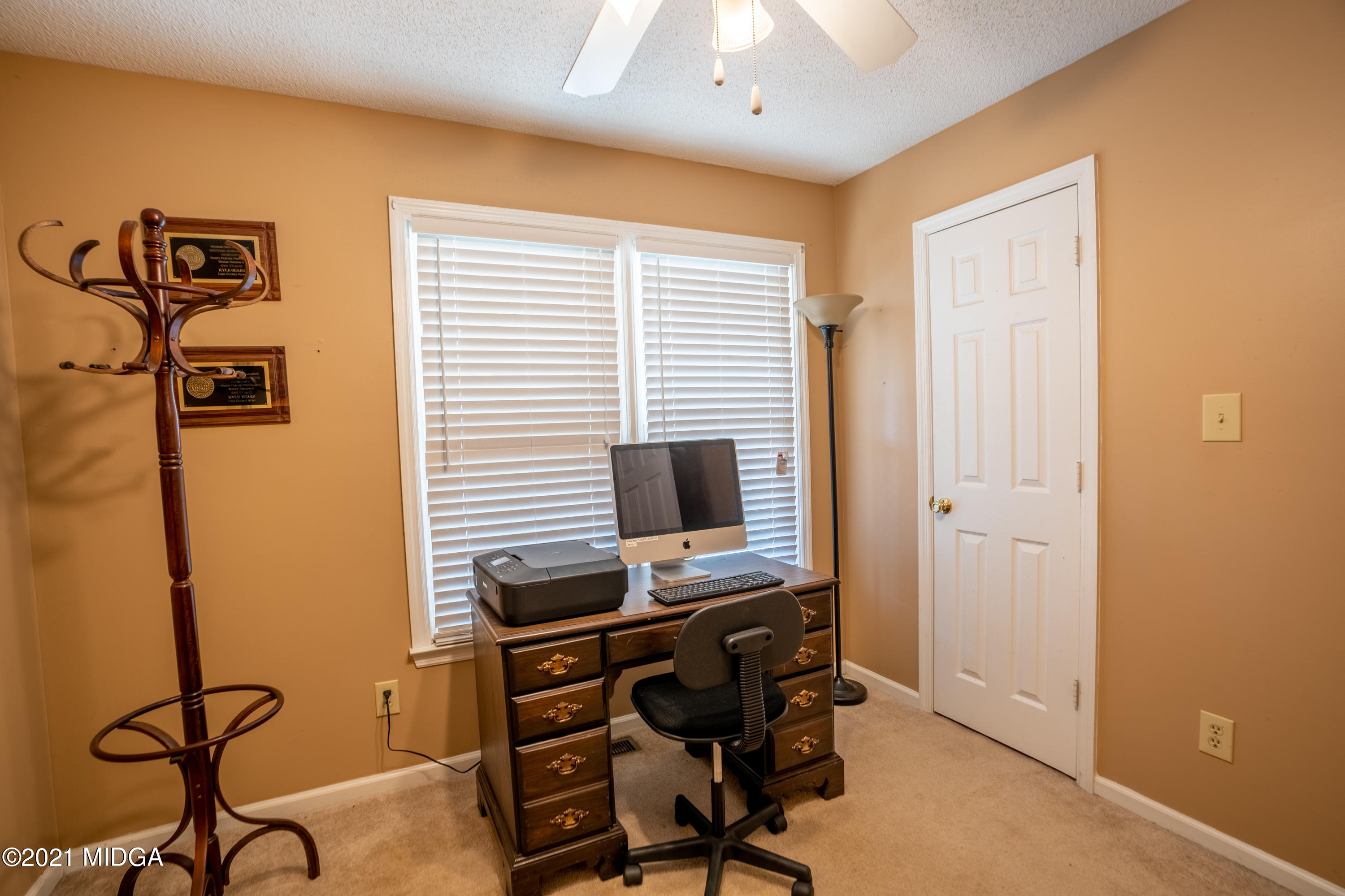 208 Camelot Road Gray, GA 31032 - Photo 20 of 41 a view of a workspace with furniture and a window
