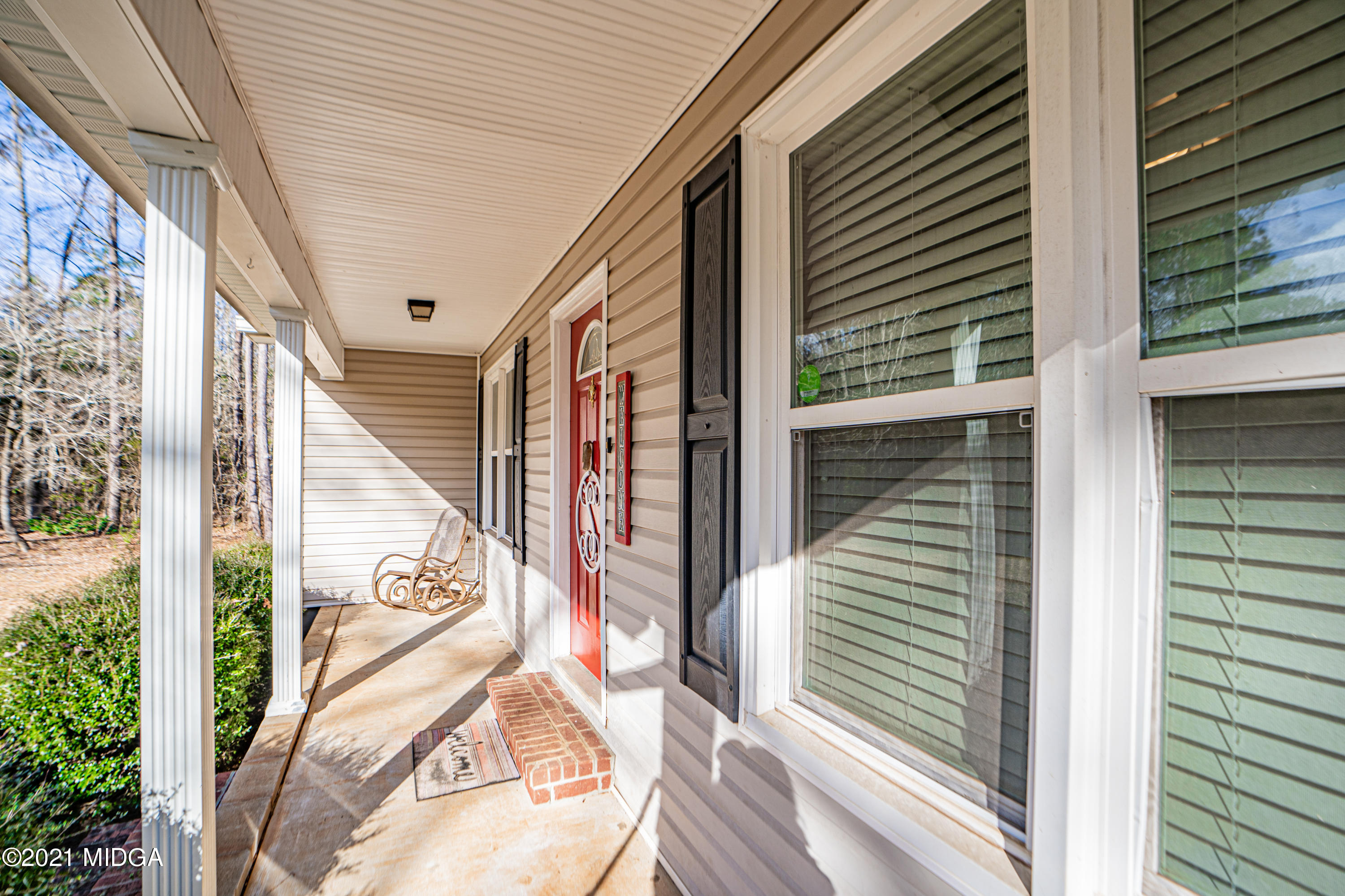 208 Camelot Road Gray, GA 31032 - Photo 3 of 41 a view of a porch with a door and wooden floor