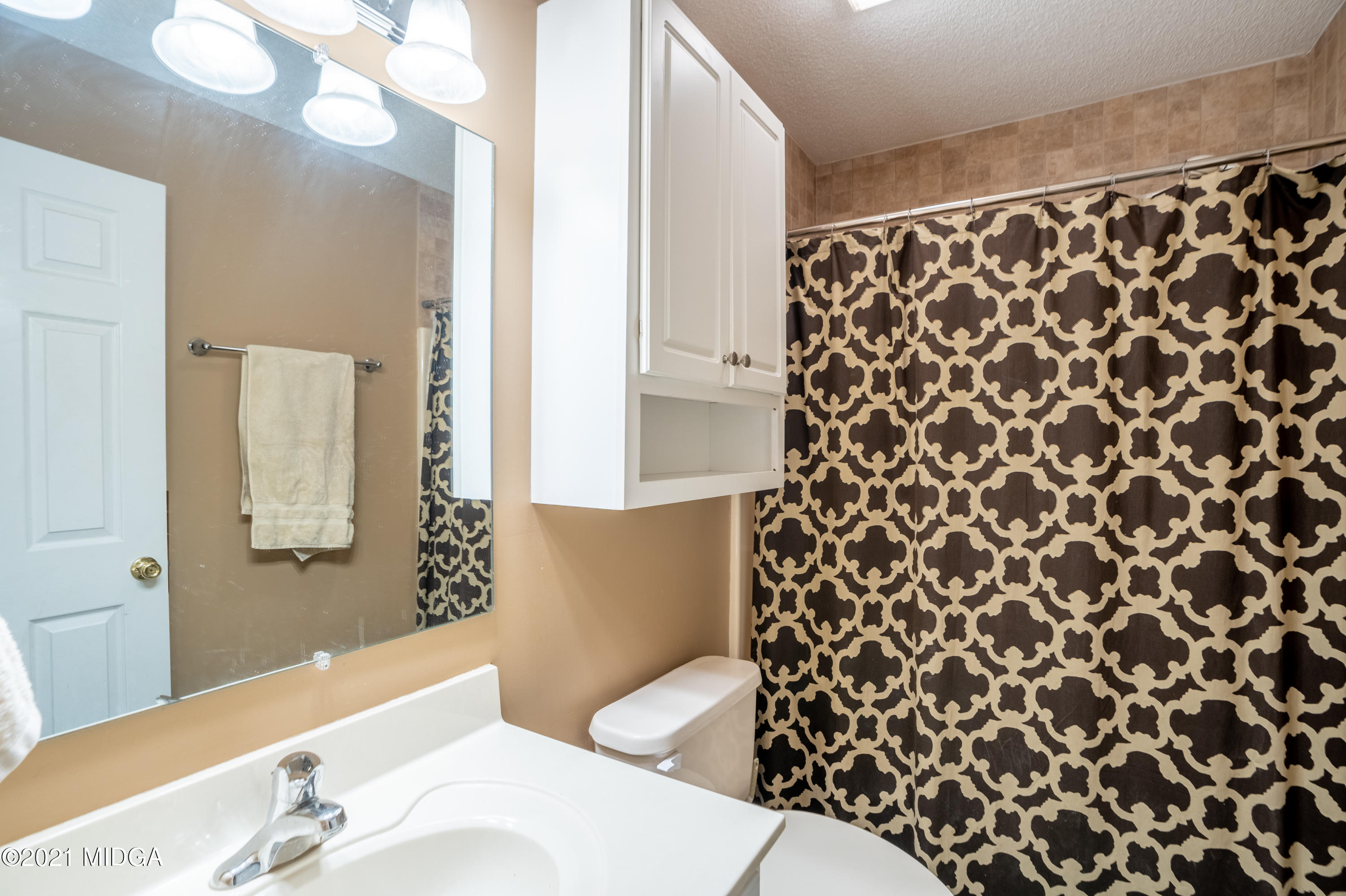 208 Camelot Road Gray, GA 31032 - Photo 22 of 41 a bathroom with a sink toilet and shower