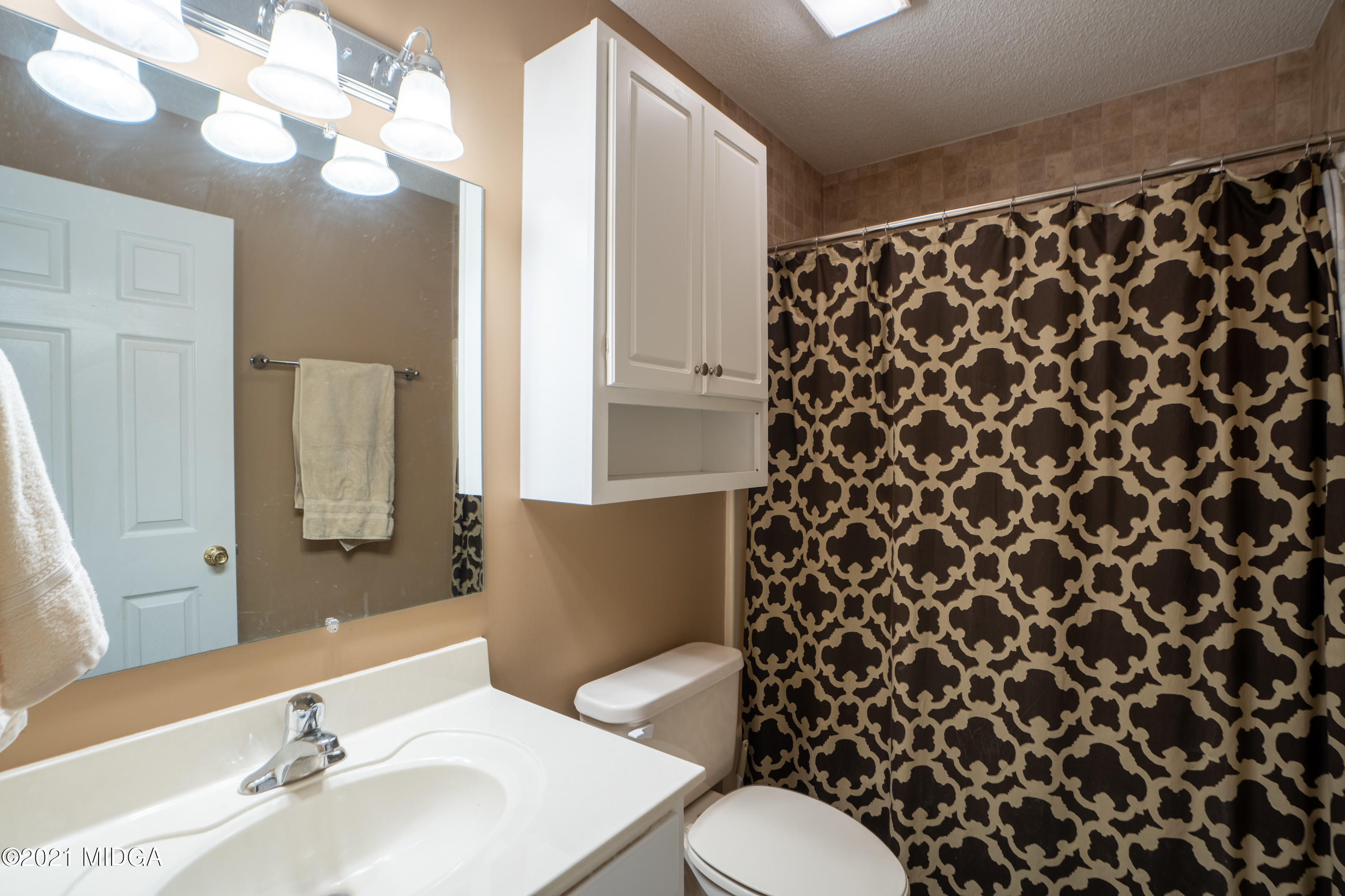 208 Camelot Road Gray, GA 31032 - Photo 29 of 41 a bathroom with a sink and a mirror