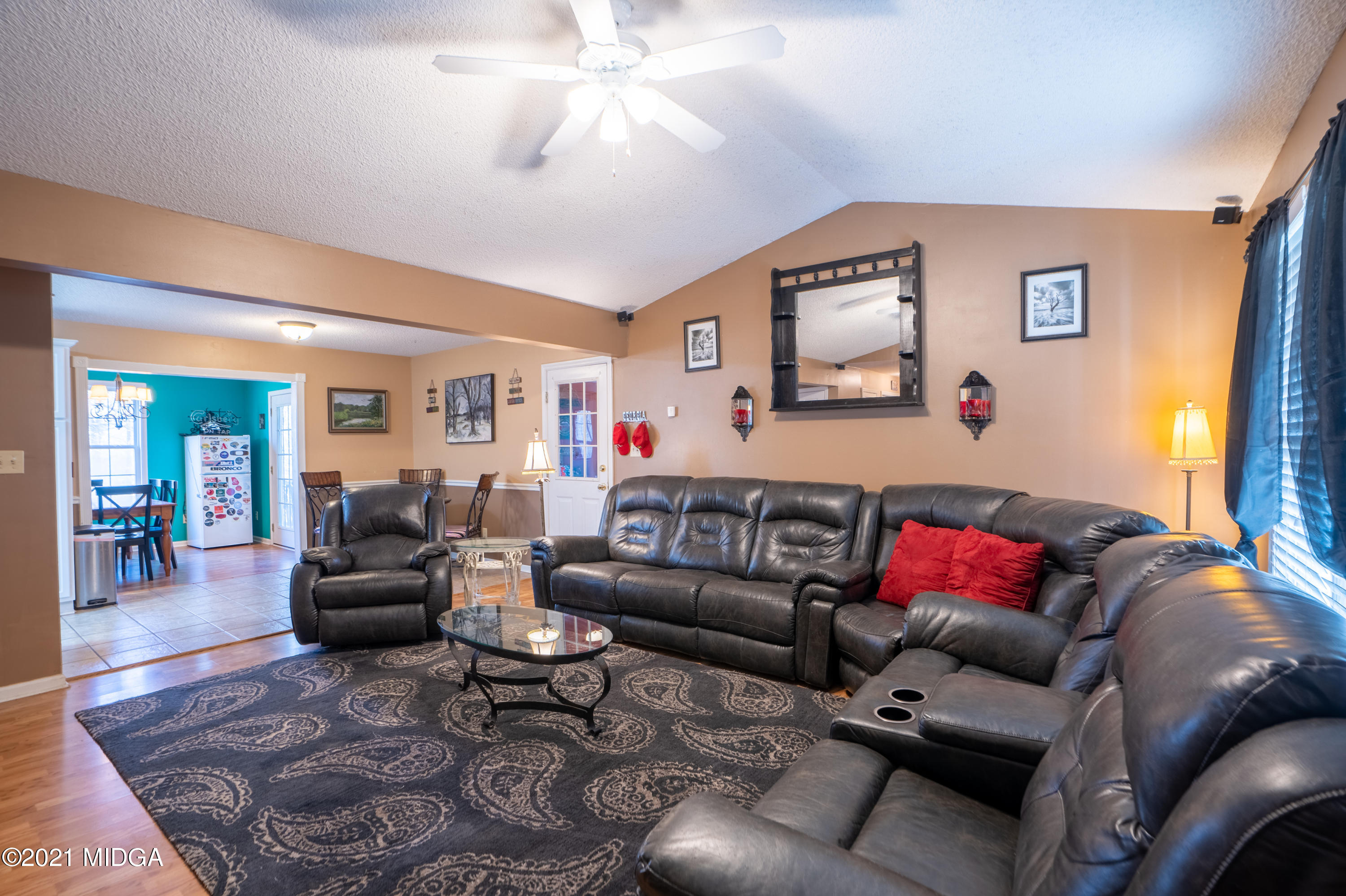 208 Camelot Road Gray, GA 31032 - Photo 4 of 41 a living room with furniture and a large window