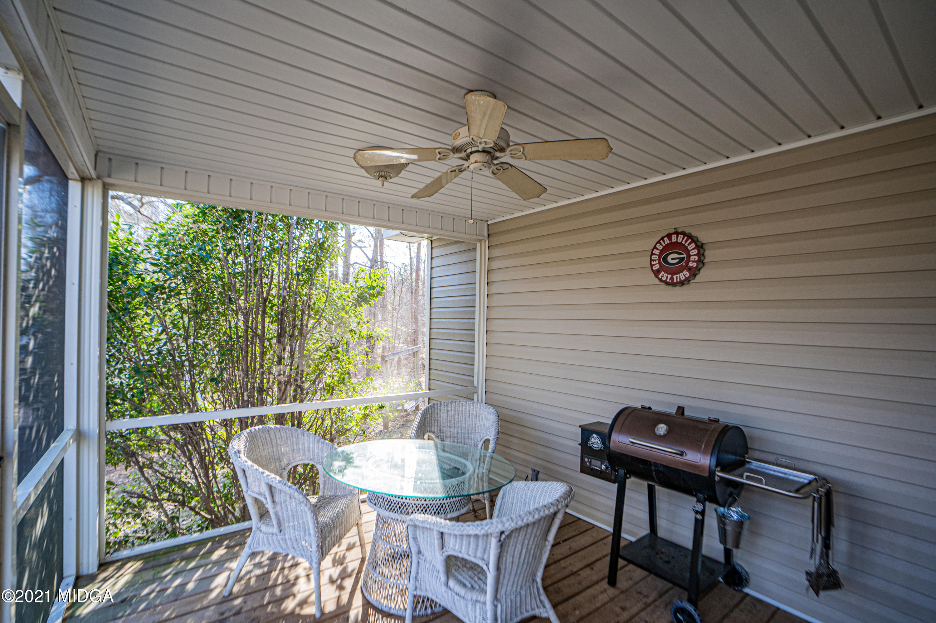 208 Camelot Road Gray, GA 31032 - Photo 33 of 41 a view of a porch with furniture and a yard