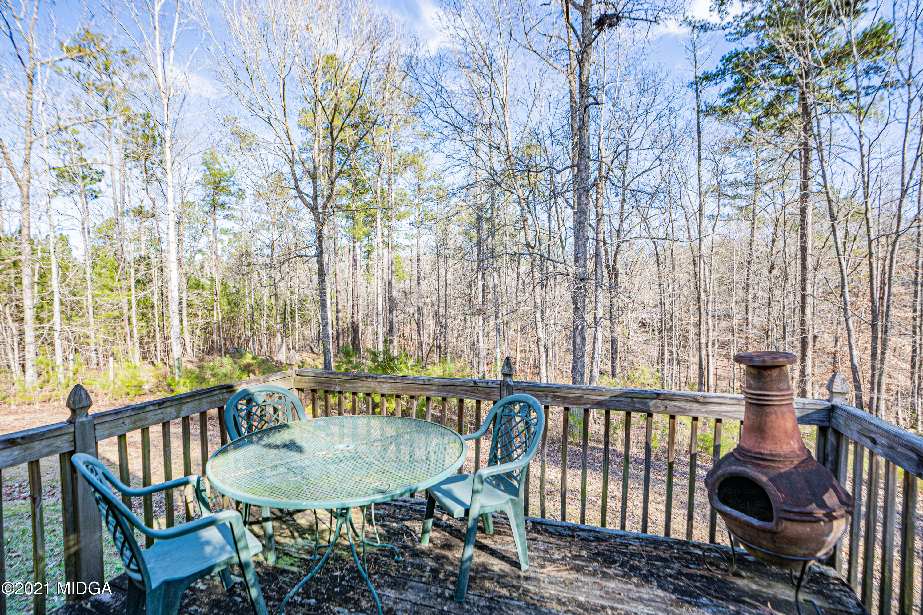 208 Camelot Road Gray, GA 31032 - Photo 35 of 41 a view of a balcony with a table and chairs