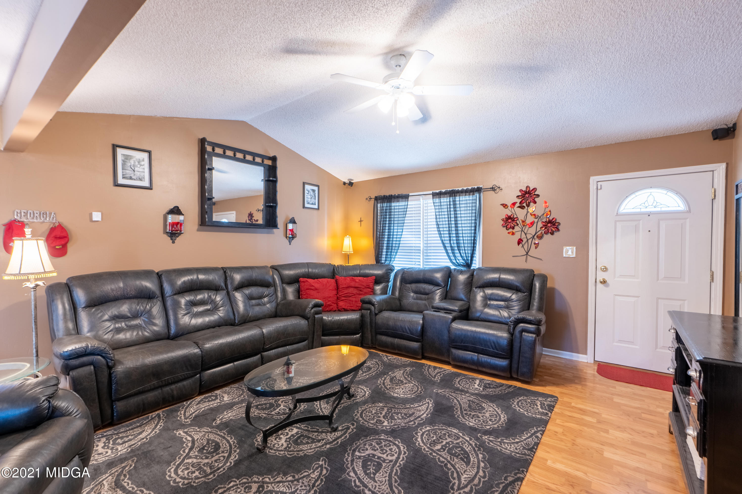 208 Camelot Road Gray, GA 31032 - Photo 6 of 41 a living room with furniture and a couch