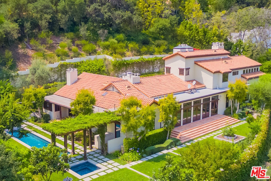 an aerial view of a house with a garden