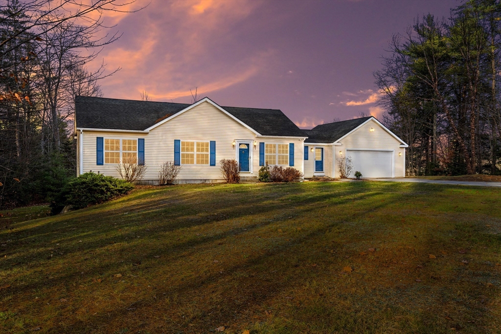 454 Little Pond Road Sandwich, NH 03227 - Photo 1 of 38 a front view of house with yard and green space