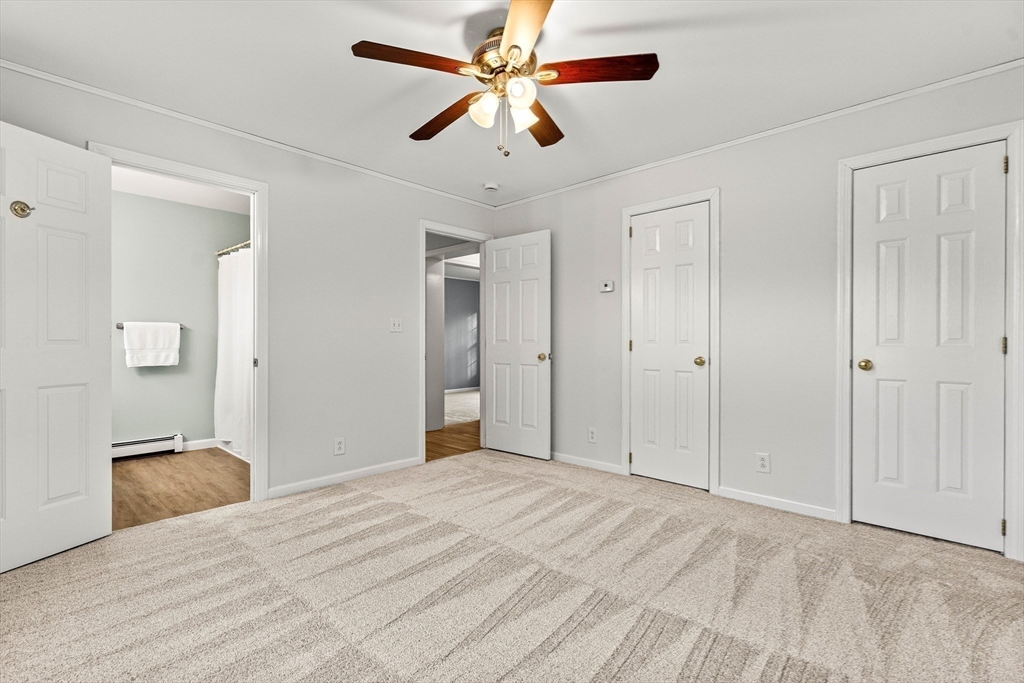 454 Little Pond Road Sandwich, NH 03227 - Photo 16 of 38 a view of a livingroom with a chandelier fan