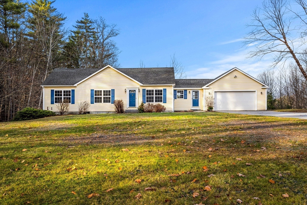 454 Little Pond Road Sandwich, NH 03227 - Photo 2 of 38 a front view of house with yard and lake view