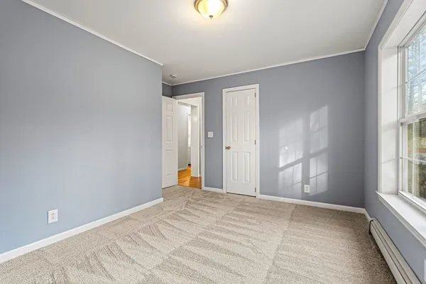 a view of an empty room with a window