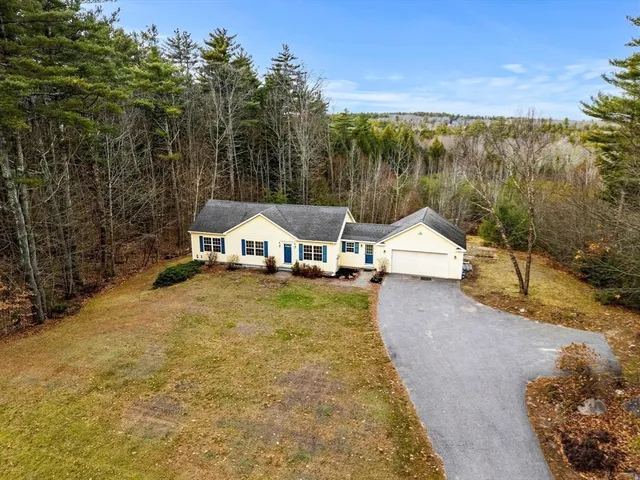 a house with trees in front of it