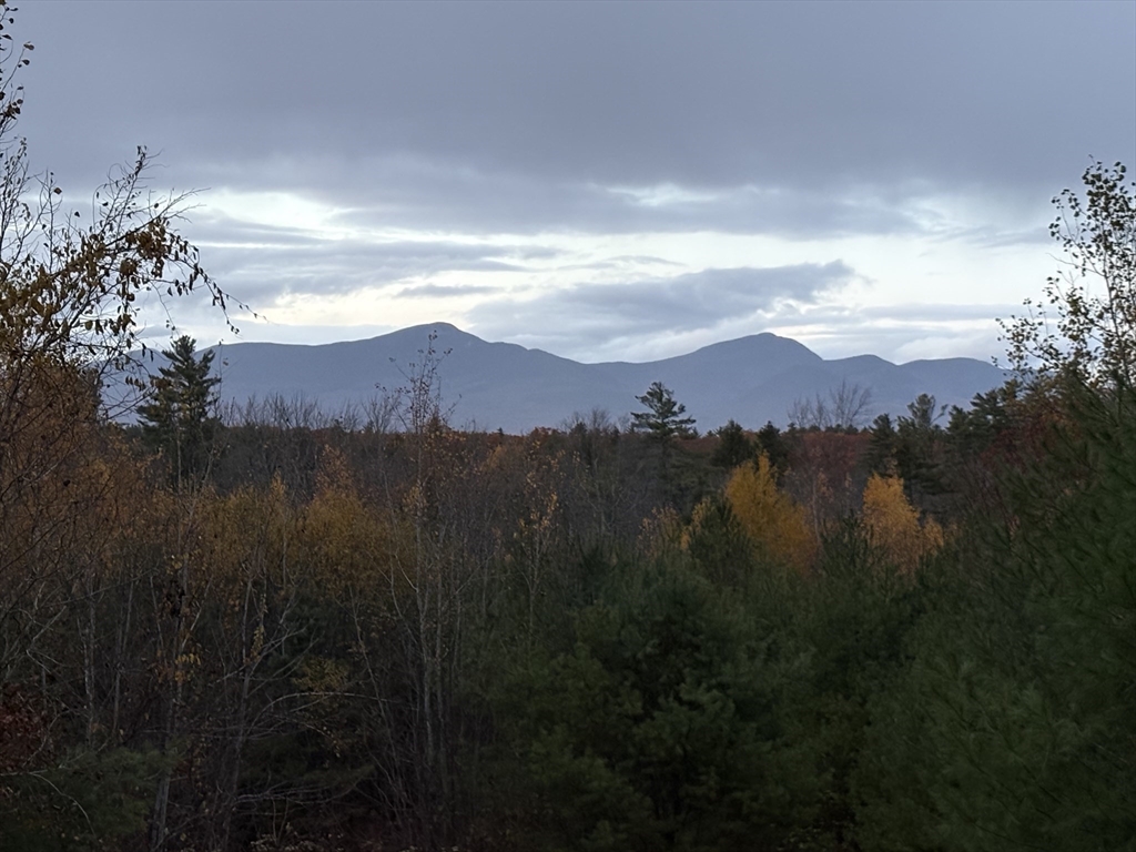 454 Little Pond Road Sandwich, NH 03227 - Photo 35 of 38 a view of mountain with sunset in background