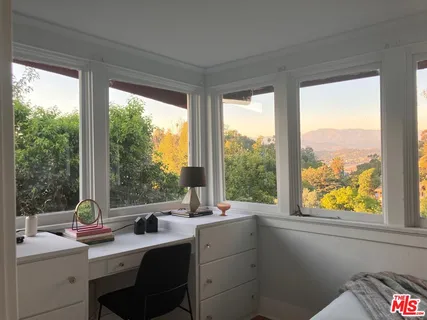 a kitchen with a sink a stove and a window