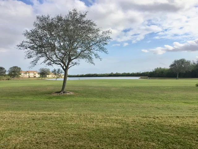 a view of outside space and a lake view