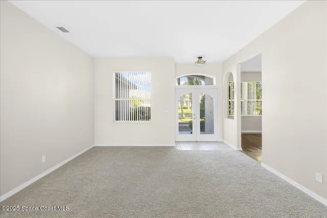 a view of a livingroom and window