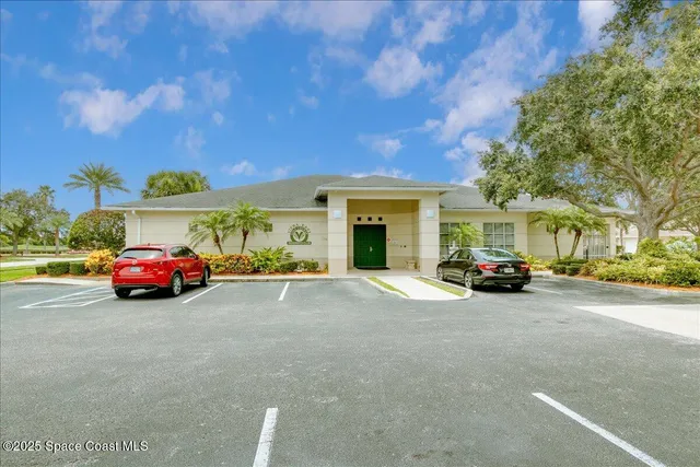 a view of yard with swimming pool and green space
