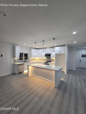 an empty room with wooden floor